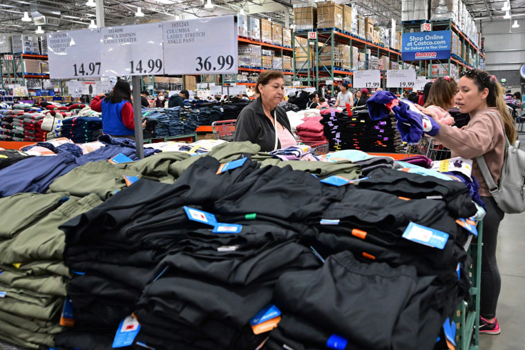 People shop for clothing at a Costco store