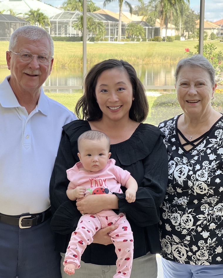 The author with her parents and daughter.