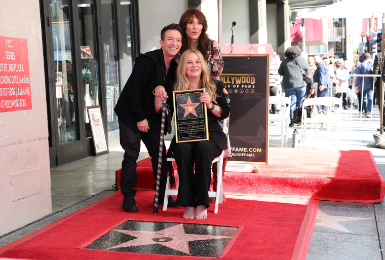 David Faustino, Katey Sagal, and Christina Applegate pose with Christina Applegate's star during her Hollywood Walk of Fame Ceremony.