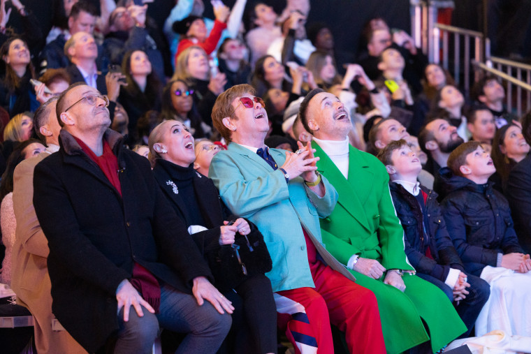 Elton John performs at the Saks Annual Holiday Window Unveiling at its New York Flagship store.