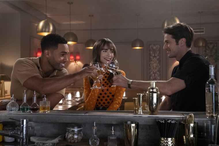Lucien Laviscount as Alfie, Lily Collins as Emily, Lucas Bravo as Gabriel in episode 305 of Emily in Paris