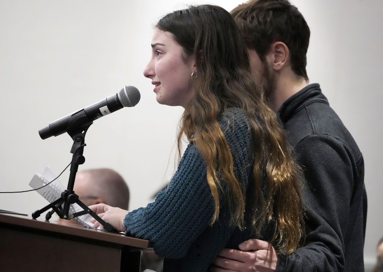 Alisha Kulich, left, the daughter of Jane Kulich, gives a victim statement as her brother, Jacob, stands by her side