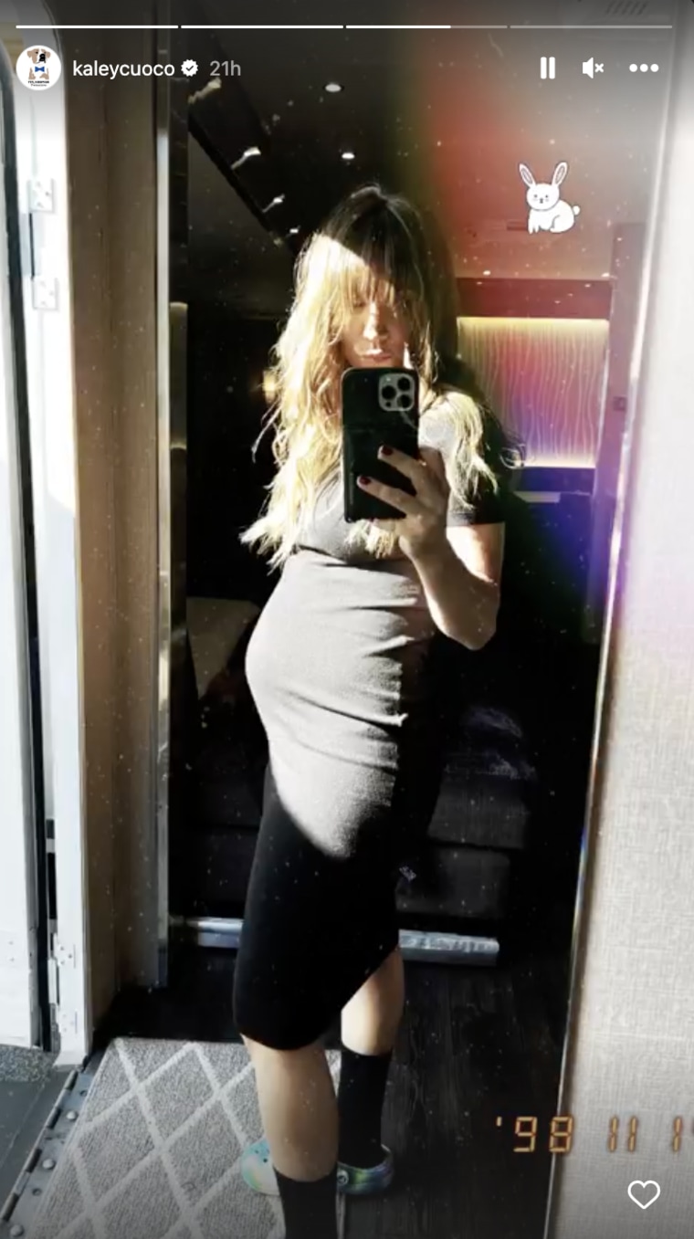 Cuoco shows off her growing baby bump.