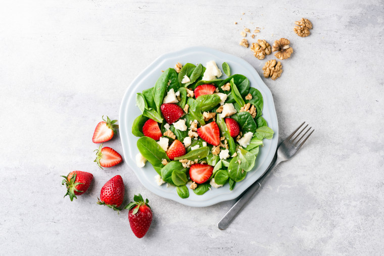 Salad with strawberries, feta cheese and walnuts
