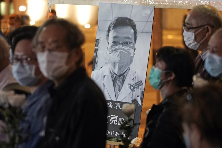 People attend a vigil for Li Wenliang, in Hong Kong