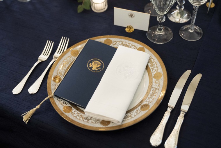 A table is set during a media preview for the State Dinner with President Joe Biden and French President Emmanuel Macron in the State Dining Room of the White House in Washington, Wednesday, Nov. 30, 2022.