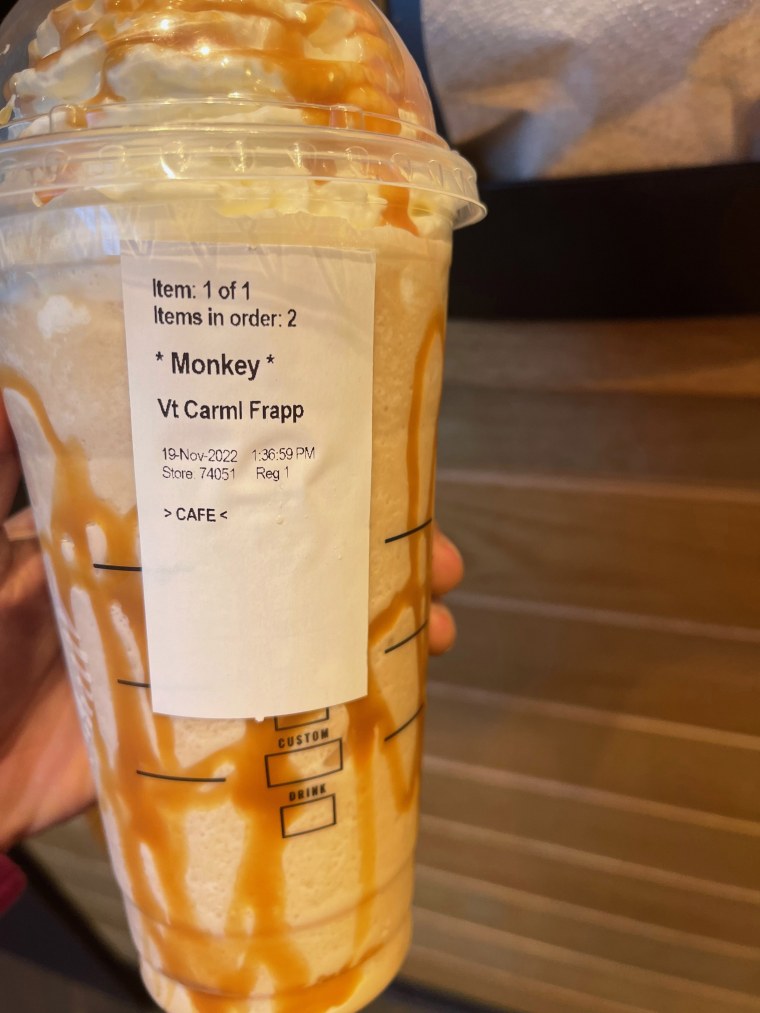 Starbucks cup, labelled with the word 'Monkey.'