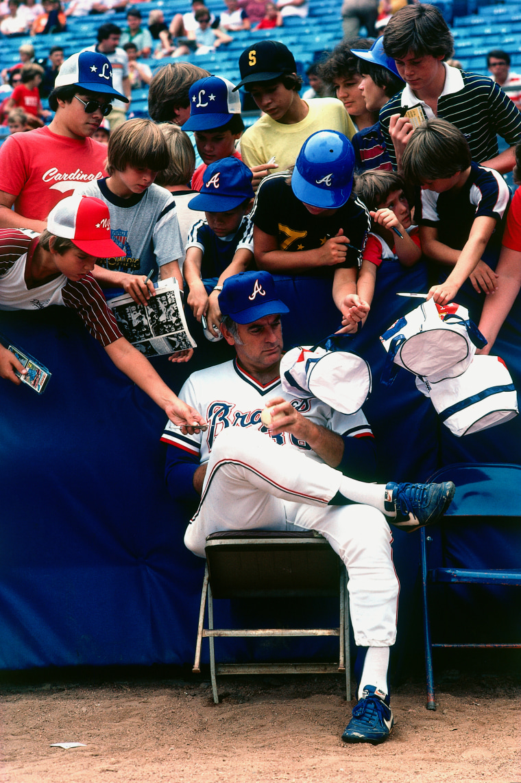 Gaylord Perry of the Atlanta Braves signing autographs prior to a season game at Fulton County Stadium in August 1981 in Atlanta.