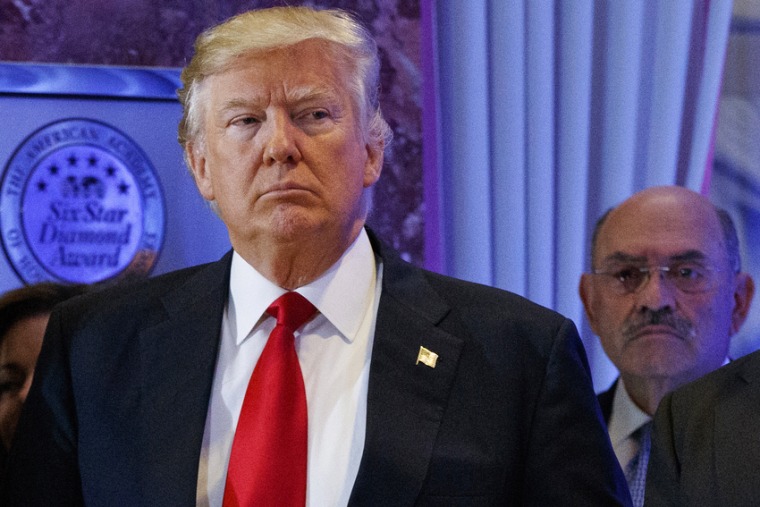 Then-President-elect Donald Trump stands next to Allen Weisselberg at a news conference in the lobby of Trump Tower in 2017.Donald Trump