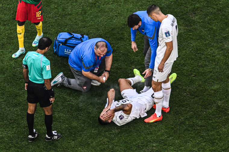 Image: Serbia's forward #09 Aleksandar Mitrovic receives medical attention during the Qatar 2022 World Cup Group G football match between Cameroon and Serbia at the Al-Janoub Stadium in Al-Wakrah, south of Doha on Nov. 28, 2022.