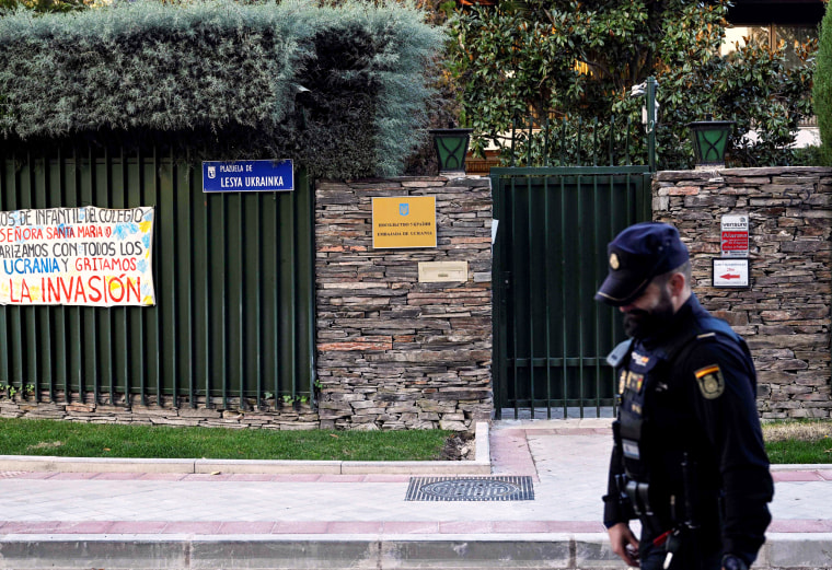A Spanish policeman stands guard next to Ukraine's embassy 