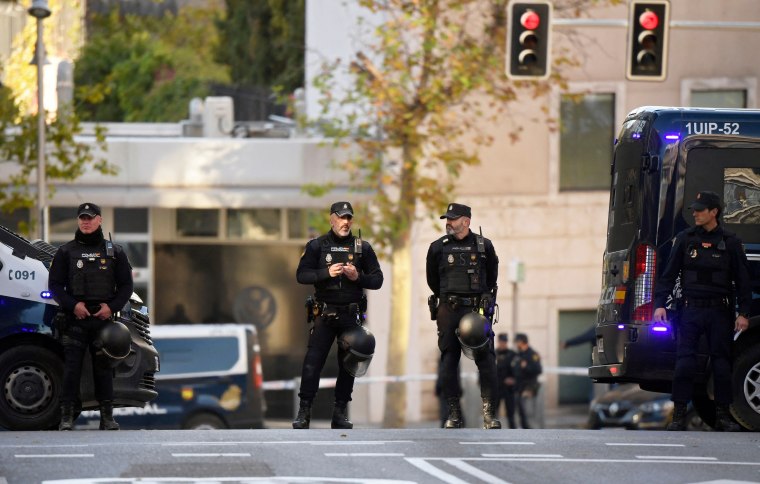 Spanish police stand guard near the United States embassy