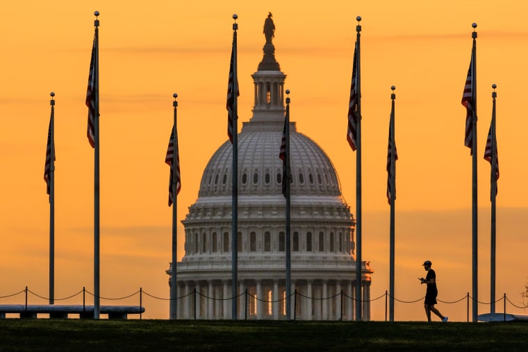 Image: A pedestrian walks past the U.S. Capitol Building in Washington on Nov. 7, 2022.