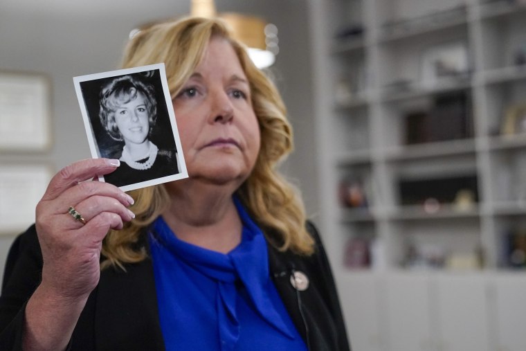 Nassau County District Attorney Anne Donnelly holds a photo of Diane Cusick on June 22, 2022, in Mineola, N.Y. 