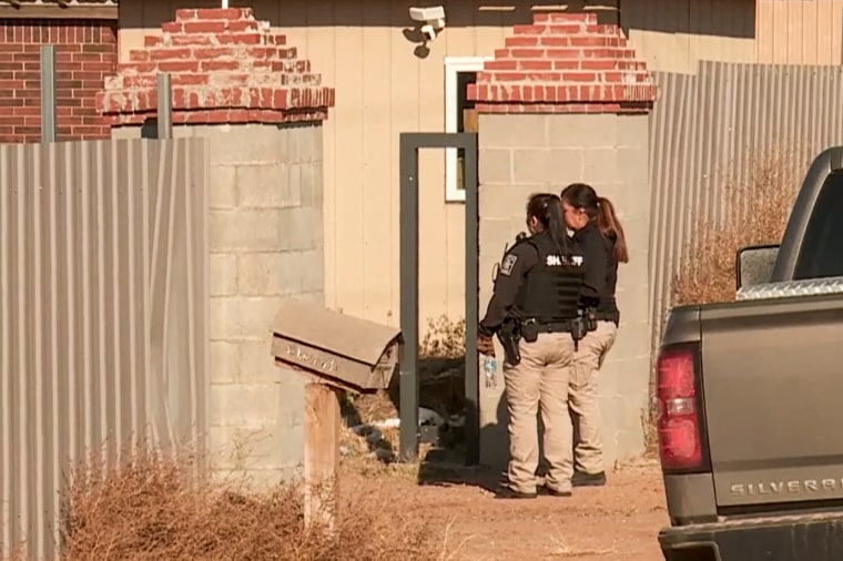 Police respond to a crime scene where four people were found dead in Kingfisher County, Okla., on Nov. 21, 2022.