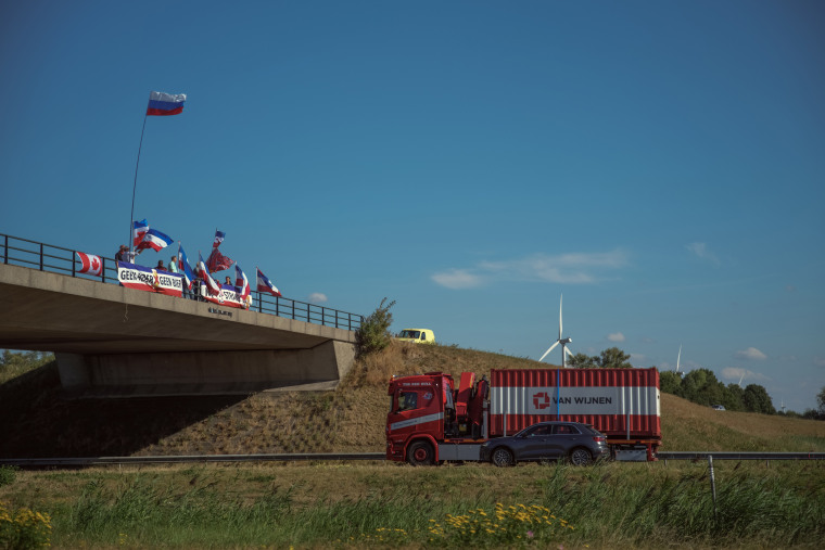 Protesters gather over the A1 motorway in support of local farmers as the Dutch government plans measures to reduce nitrogen emissions. 