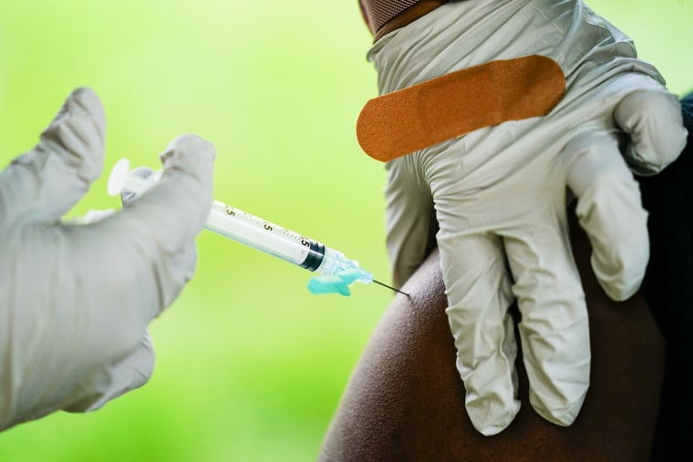 A health worker administers a dose of a Pfizer-BioNTech Covid-19 vaccine in Reading, Pa., on Sept. 14, 2021.