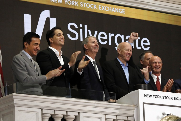 Slivergate CEO Alan Lane, second from right, rings the New York Stock Exchange opening bell before his bank's IPO begins trading