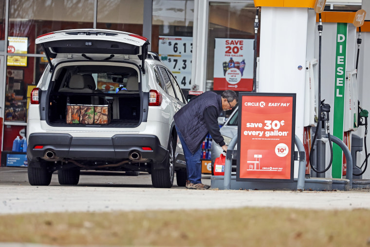 Residents fill gas containers just outside the affected area where a serious attack on critical infrastructure has caused a power outage to many around Southern Pines, N.C., on Dec. 5, 2022.
