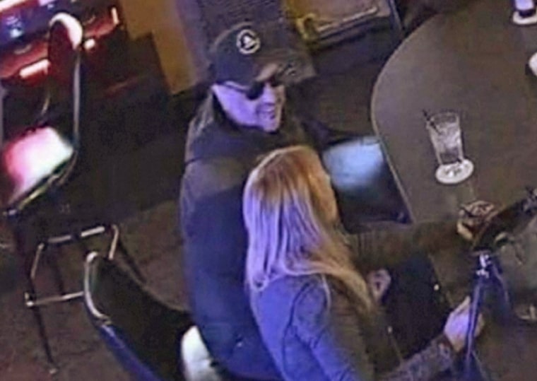 An image from a surveillance video shows a man believed to be Timothy Olson moments before the woman passed out in the bar.