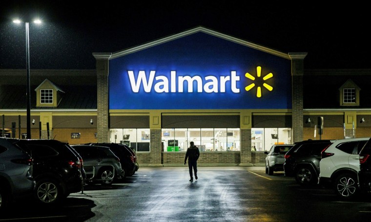 A shopper leaves a Walmart in Wilmington, Del. 
