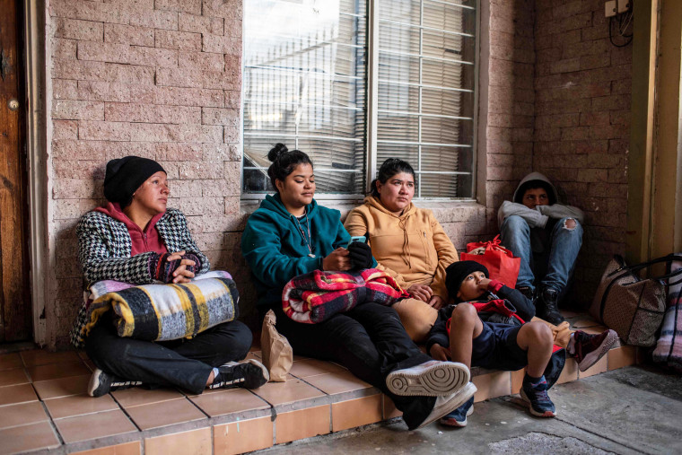 A group of migrants seek shelter in a church