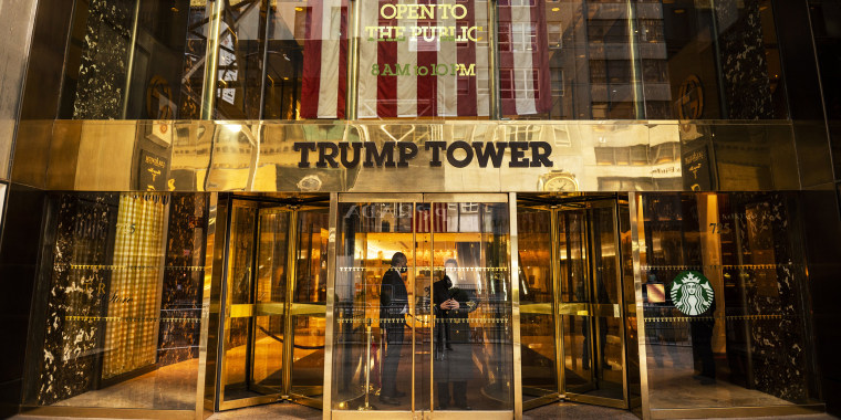 Image: Security guards stand at the entrance to Trump Tower in New York.