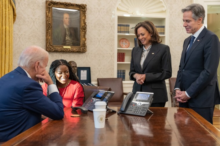 President Biden speaks with with Brittney Griner on the phone, accompanied by Cherelle Griner at the Oval Office on Thursday. 