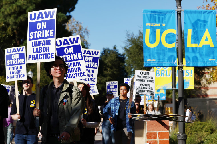 Academics and union supporters march and demonstrate on the UCLA campus amid a statewide strike by nearly 48,000 unionized University of California workers on November 15, 2022