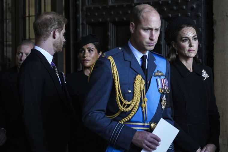 Prince Harry and Meghan walk behind Prince William and Princess Kate after having paid their respects to Queen Elizabeth II in Westminster Hall in September.