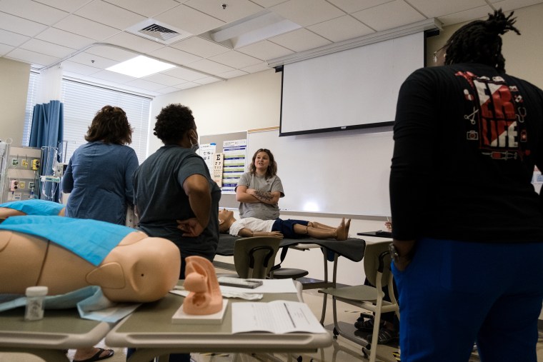 Students in the Sexual Assault Nurse Examiner training at Fayetteville State University gather practice examinations on a model