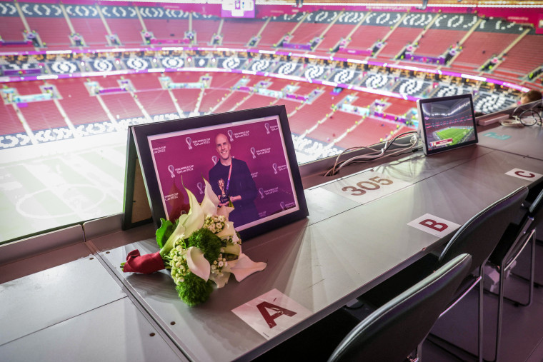 Image: Flowers are placed in memory of Grant Wahl ahead of the FIFA World Cup Qatar 2022 quarter-final match between England and France at Al Bayt Stadium on December 10, 2022 in Al Khor, in Qatar.