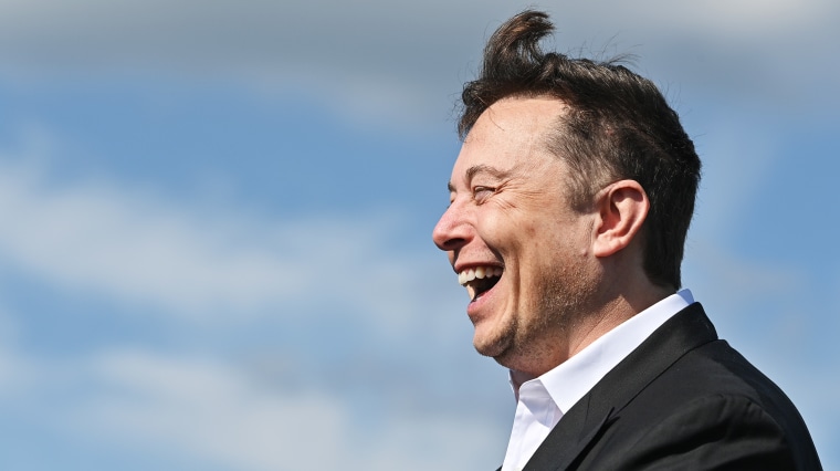 Image: Elon Musk laughing.