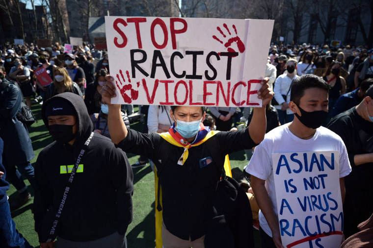 Members and supporters of the Asian-American community attend a "rally against hate" at Columbus Park in New York City on March 21, 2021. - Three massage parlors around Atlanta were targeted March 16, 2021, and a 21-year-old suspect was arrested. Robert Aaron Long faces eight counts of murder and one charge of aggravated assault.
