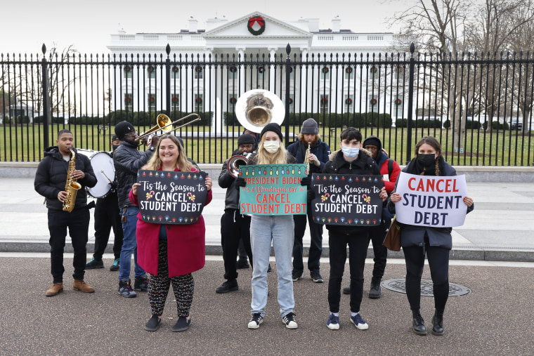 Activists call on President Biden to cancel student debt outside the White House on Dec. 15, 2021. 