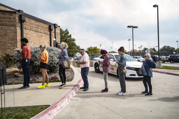 Voters in line before casting ballots at a polling location in Dallas, Texas, on Nov. 8, 2022.