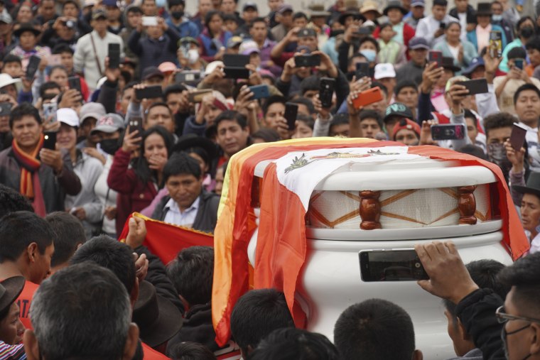 People attend the funeral procession of a child who was killed during protests against new President Dina Boluarte in Andahuaylas, Peru