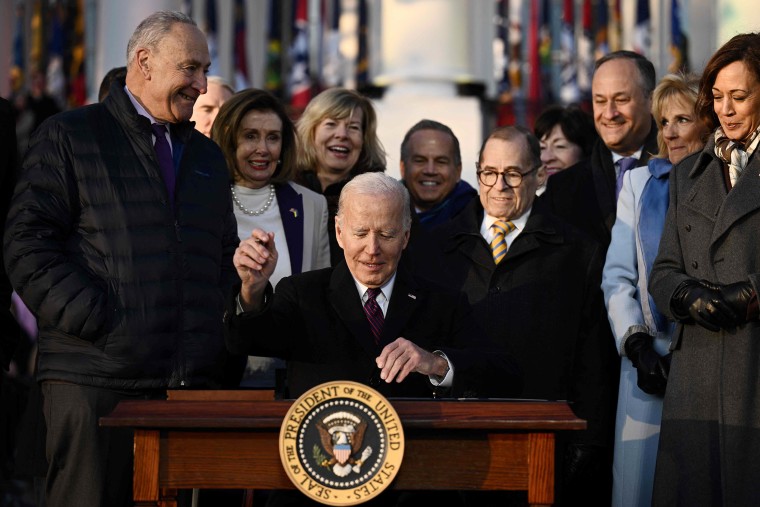 President Joe Biden signs the Respect for Marriage Act on the South Law of the White House in on Dec. 13, 2022.