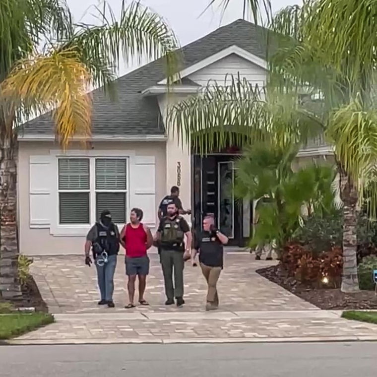 Josh Edwards is taken into custody outside the Edwards family’s New Smyrna Beach home.