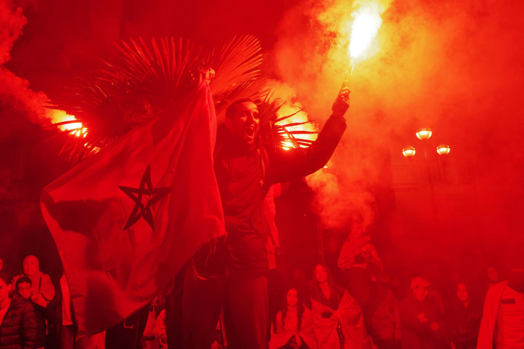 Morocco fans light flares after victory over Portugal.
