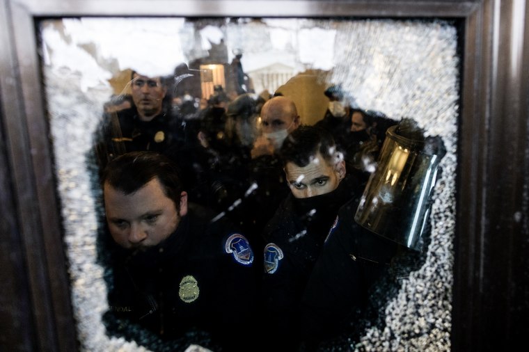 Image: Capitol police intervene as Trump supporters breached security and entered the Capitol building in Washington on January 6, 2021.