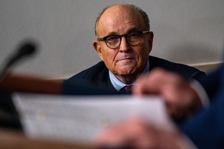 Rudy Giuliani attends a news briefing at The White House