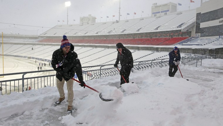Snow is removed from the stands at Highmark Stadium before an NFL game Saturday, Dec. 17, 2022, between the Buffalo Bills and the Miami Dolphins in Orchard Park, N.Y.