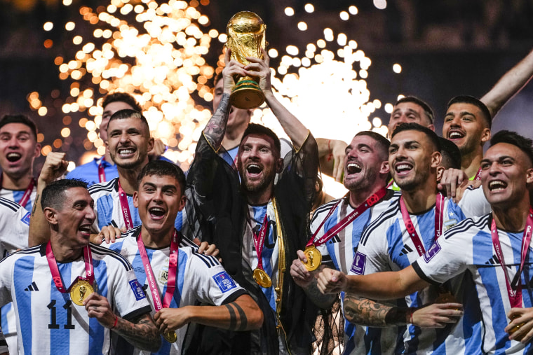 Argentina's Lionel Messi holds up the trophy after winning the World Cup in Lusail, Qatar, on Dec.18, 2022.