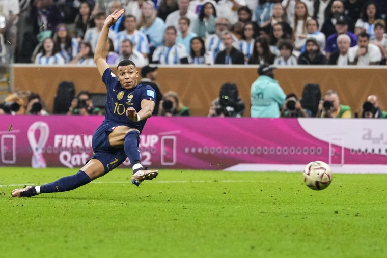 France's Kylian Mbappe scores his side's second goal during the World Cup final soccer match between Argentina and France in Lusail, Qatar, on Dec.18, 2022.