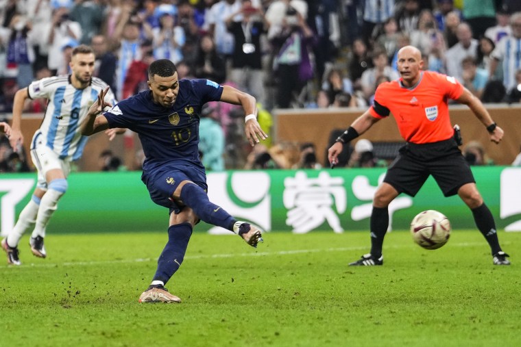 France's Kylian Mbappe scores his side's third goal during the World Cup final against Argentina on Dec. 18, 2022, in Qatar.