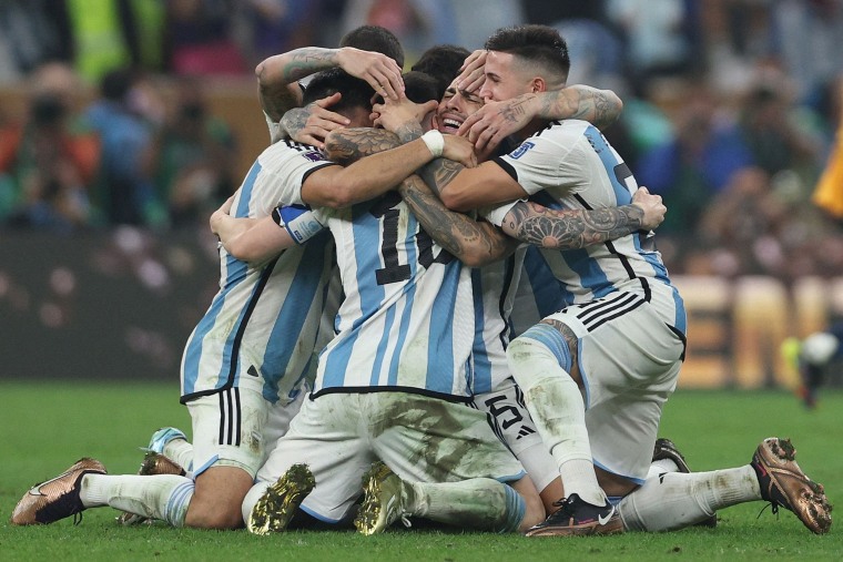 Argentina's forward Lionel Messi, center, celebrates with teammates after they won the Qatar 2022 World Cup final football match against France in Qatar.