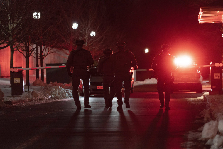 York Regional Police tactical officers work the scene of a shooting in Vaughan, Ontario, Sunday, Dec. 18, 2022. 