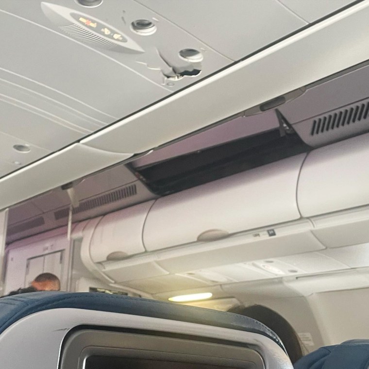 Cracked overhead panelling after severe turbulence rocked the Hawaiian airlines flight. 