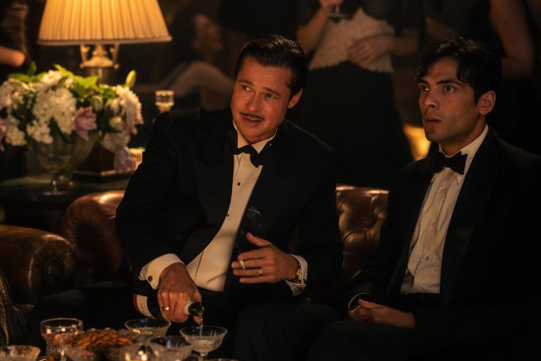 Diego Calva as Manny Torres with Brad Pitt as Jack Conrad in "Babylon." 